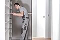 man installing shelf inside closet in home 2026 09 23 23 00 32 utc
