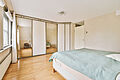 modern bedroom interior with bed and mirrored ward 2026 01 07 23 28 13 utc