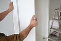assembling white furniture with tool in the home 2026 03 16 02 26 43 utc
